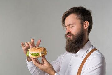 Man with beard in white shirt and suspenders