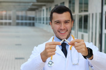 Doctor crushing a cigarette with copy space