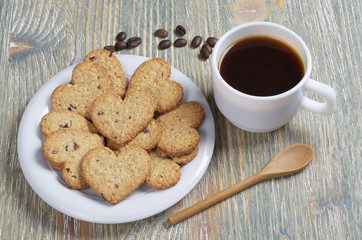 Coffee and homemade cookies in the shape of a heart