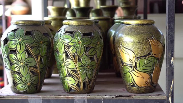 Handmade traditional craft known as 'labu sayong' normally used as gift or souvenir found in Perak,Malaysia. Clay pottery arts. Artistic clay container carving. UNGRADED.Panning Shot