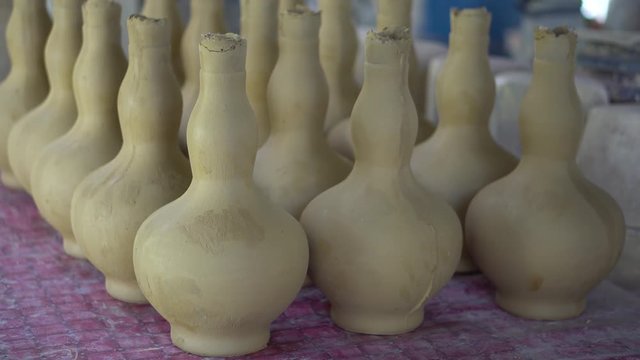 Handmade traditional craft known as 'labu sayong' normally used as gift or souvenir found in Perak,Malaysia. Clay pottery arts. Artistic clay container carving. UNGRADED.Panning Shot
