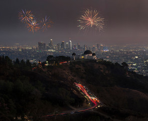 Downtown Los angeles cityscape with fireworks celebrating New Year's Eve.