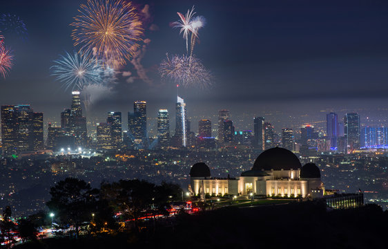 Downtown Los angeles cityscape with fireworks celebrating New Year's Eve.