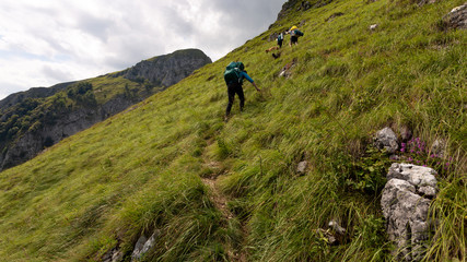 Group of friends hiking through Buila Vanturarita National Park in Romania