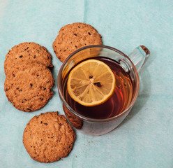 Tea with lemon. Tangerines and four oatmeal cookies.