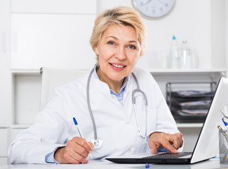 Doctor in gown waiting for patient