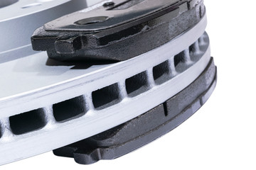 Brake discs and brake pads isolated on white background. Auto parts. Brake disc rotor isolated on...