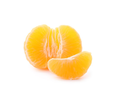 Pieces of fresh ripe tangerine on white background