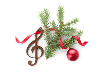 Composition with Christmas tree branch, decor and wooden music note on white background, top view