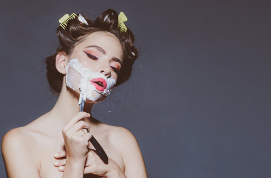 pretty girl in vintage style. retro woman shaving with foam and razor blade. pin up woman with trendy makeup. pinup girl with fashion hair. morning grooming and skincare, copy space. beauty salon
