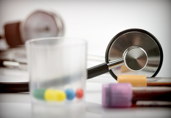 stethoscope and vials vaccine in a hospital, conceptual image