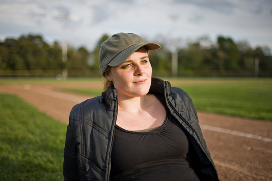 Woman sitting on sport field
