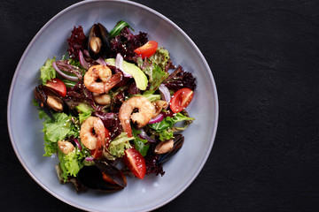 seafood salad, traditional recipe, antipasto, restaurant menu. healthy salad of shrimps, mussels and vegetables, diet food