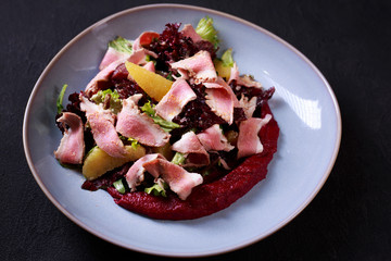 appetizing gourmet warm salad with goose meat and beetroot mousse, banquet, restaurant menu, dining concept