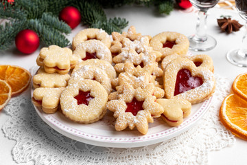 Linzer Christmas cookies arranged on a plate