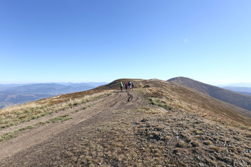 hiking in the mountains,tourism, people on top of the mountain