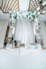 Place for wedding ceremony in white color ,with white fireplace