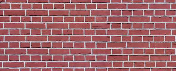 Old red wash brick wall texture. Wide panorama of masonry	