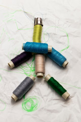 man of spools of thread. have toning. close-up