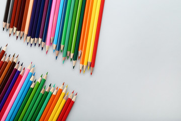 Colored pencils on grey background