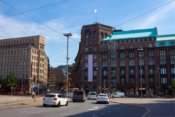 Fototapeta premium Square in the center of the city of Helsinki the capital of Finland on a hot summer day. The display on the building shows +25 degrees Celsius.