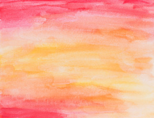 Abstract hand painted full frame watercolor background in red, orange and yellow with watercolour stains and paper texture.