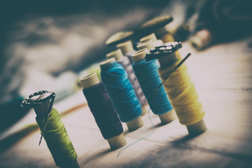 spools of thread and buttons and needles in them. The concept of escorts lead prisoners or...