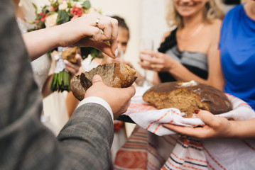 Wedding loaf. Bread and salt for the bride and groom Russian wedding tradition.  The bride...