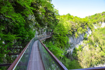 Fototapeta na wymiar aqueduct bridge in the mountains high green landscape