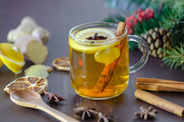 Brewed delicious herbal tea on a wooden brown background -