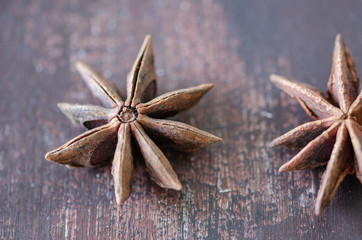 Star anise on wooden background
