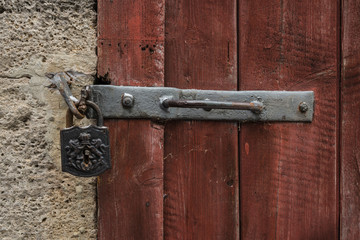 Historic padlock on a medieval door.