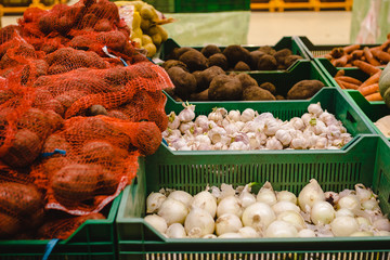 Assortment of vegetables at supermarket. shelves with variety vitamin products in fruit and vegetables department in the supermarket