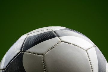 Fototapeta na wymiar close-up of a soccer ball on a green background