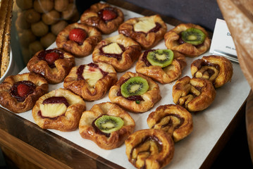 Danish pastry buns with fresh fruit kiwi, strawberry, pineapple 