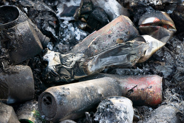 burning garbage, coal, littering the environment, burning cans