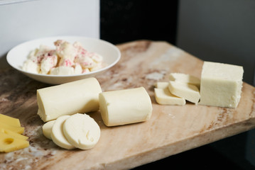 Hotel restaurant table with various types of cheese. Buffet cate