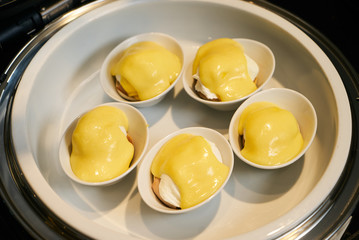 Eggs Benedict- English breakfast, close-up. Hotel restaurant buf