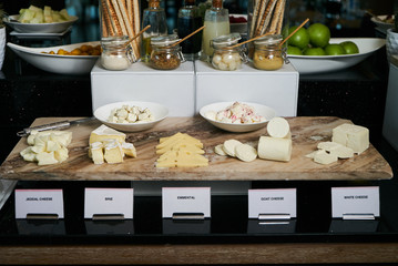 Various types of cheese on Hotel restaurant table. Buffet cateri