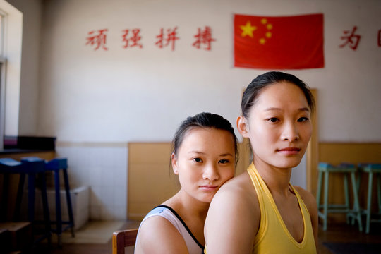 Portrait of girls sitting in gym