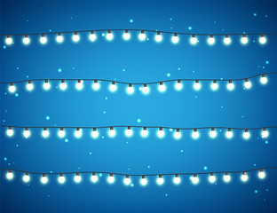 Fototapeta premium Christmas glowing lights on white background. Garlands with colored bulbs. Xmas holidays. Christmas greeting card design element. New year,winter.