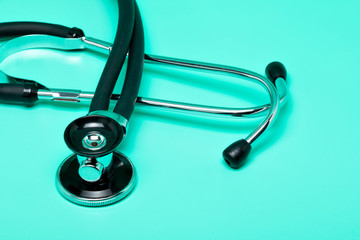 Stethoscope on a bright green background