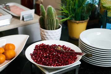 Pomegranate and Tangerines with sliced pineapple and melon. Heal