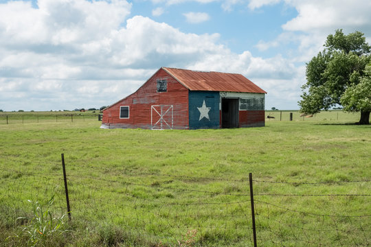 Texas flag painted on old barn