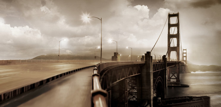 Suspension bridge underneath moody sky.