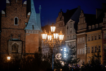 Obraz premium View at city pole lamp in Christmas fair decoration in Wroclaw, Poland