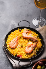 Traditional Spanish paella with seafood. Prepared in traditional pan