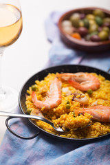 Traditional Spanish paella with seafood. Prepared in traditional pan