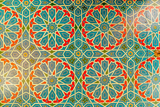 Colorful geometric pattern of Islamic mosaic decorated walls in Morocco