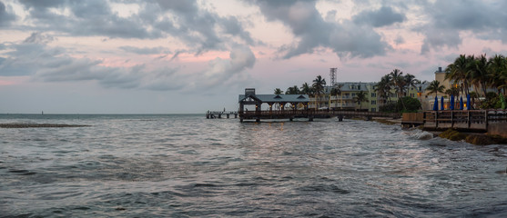Panoramic seascape view of the Atlantic Ocean Coast during a dramatic cloudy sunrise. Taken in Key...